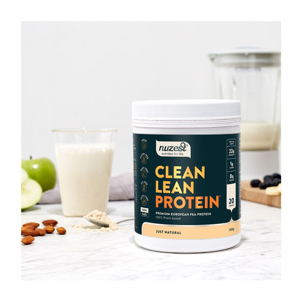 A jar of Nuzest Clean Lean Protein in a kitchen setting.